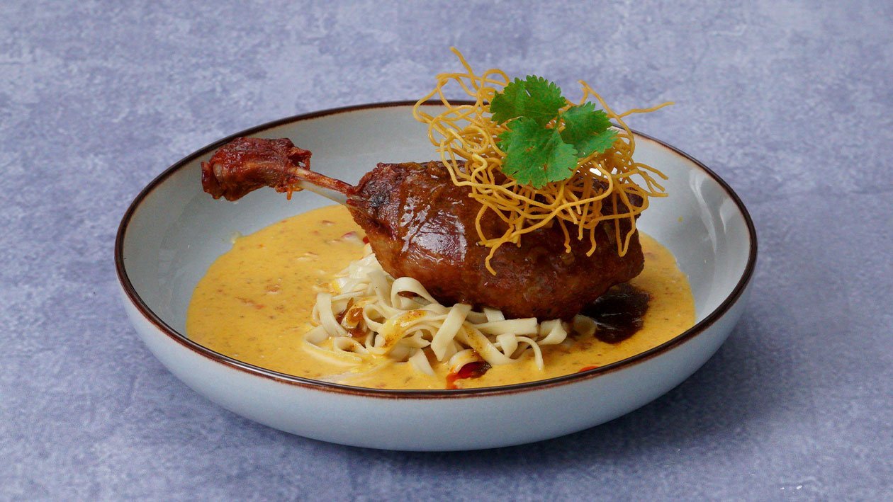 Duck Confit with Curry Demi-Glace and Khao Soi